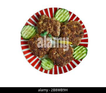 Shami kebab, variety of kebab, originating from the Indian subcontinent,  Awadhi cuisine, Traditional assorted Indian  dishes, Top view. Stock Photo