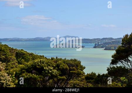 Aerial view on the multi colored blue waters of the bay of Islands New Zealand Stock Photo