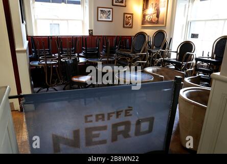 Stacked tables and chairs in a Cafe Nero in Edinburgh as the cafe only offers takeaways due to the coronavirus outbreak. Stock Photo