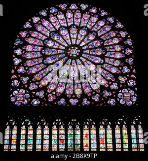 PARIS, FRANCE - SEPTEMBER 26, 2018 North Rose vitrages stained glass window in interior of cathedral Notre-Dame de Paris before fire April 15, 2019
