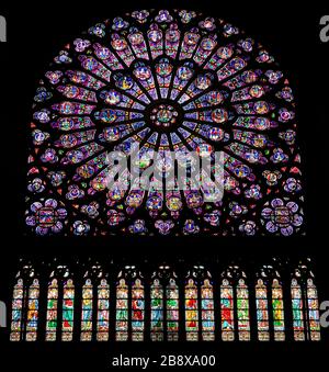 PARIS, FRANCE - SEPTEMBER 26, 2018 North Rose vitrages stained glass window in interior of cathedral Notre-Dame de Paris before fire April 15, 2019