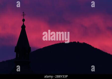 Pink sky with church tower Stock Photo