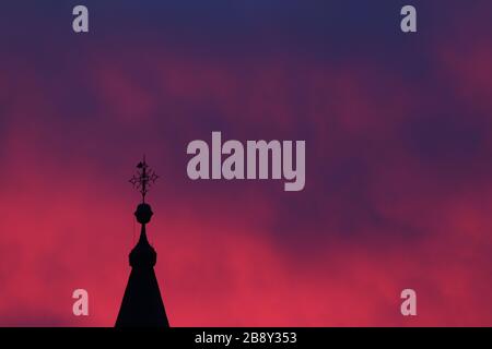 Pink sky with church cross Stock Photo