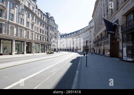 A very quiet Regents Street in Central London during a quiet lunch time on Monday the 23rd of March 2020, as the spread of the Coronavirus (COVID-19) Stock Photo