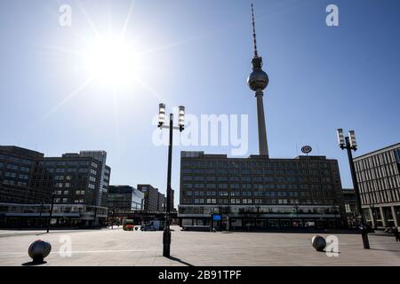 Berlin, Germany. 23rd Mar, 2020. Few people are on the move at Alexanderplatz. Credit: Britta Pedersen/dpa-Zentralbild/dpa/Alamy Live News Stock Photo