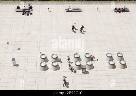 People walk across and relax on the Polyterrasse below the Federal Institute of Technology (ETH) in Zürich, Switzerland. Stock Photo