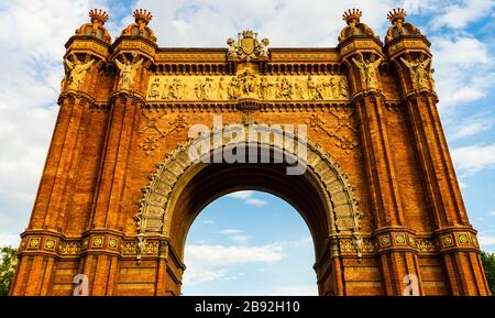 The Arc de Triomf is a triumphal arch in the city of Barcelona in Catalonia, Spain. Triumphal Arch in Barcelona. Stock Photo