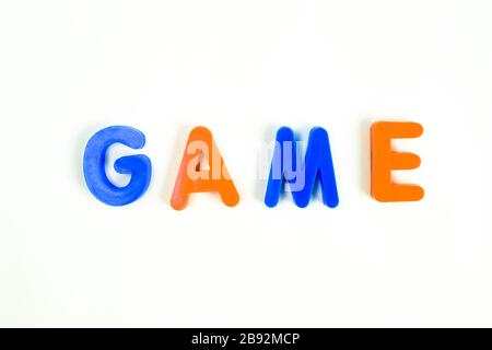 GAME written in various colored letter blocks on an isolated white background Stock Photo