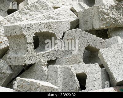 Pile of broken concrete bricks ready to be recycled on a construction and demolition waste management site Stock Photo