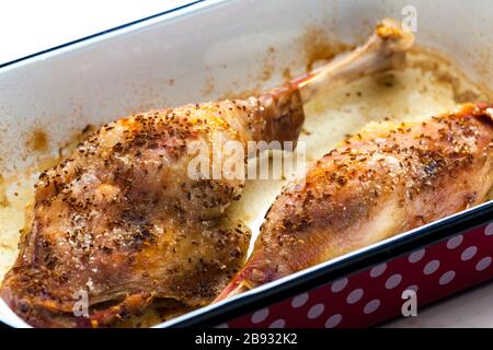 baked goose legs with cumin in frying pan Stock Photo