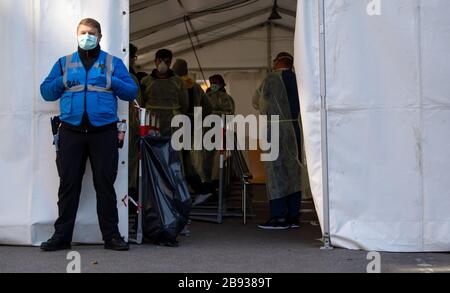 Munich, Germany. 23rd Mar, 2020. Medical personnel work in a new test station in front of the Tropical Institute for people suspected of having Covid-19. Only medical personnel and specific professional groups such as the police or fire brigade are to be tested at the new test station. Credit: Sven Hoppe/dpa/Alamy Live News Stock Photo