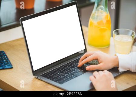 woman working on laptop in cafe white screen freelancer concept Stock Photo