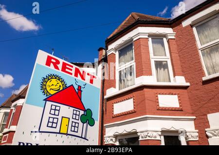 Estate agent rent sign outside terraced house, UK, London Stock Photo