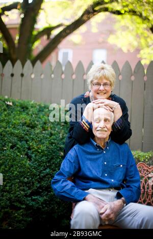Woman resting on her husband's set Stock Photo
