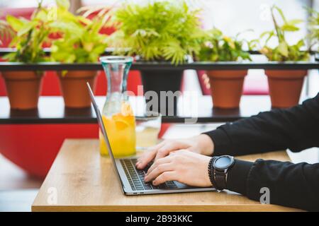 mans hands on laptop keyboard freelance concept Stock Photo