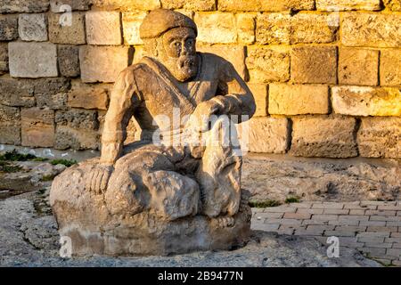 Statue in front of Maiden Tower, Baku, Azerbaijan Stock Photo