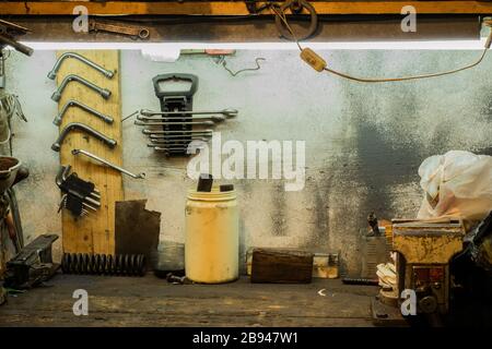 Workbench and old tools in the garage Stock Photo