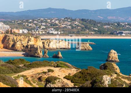 Lagos, Portugal - 7 March 2020: View of Lagos coastline in Portugal, Dona Ana Beach in the distance Stock Photo