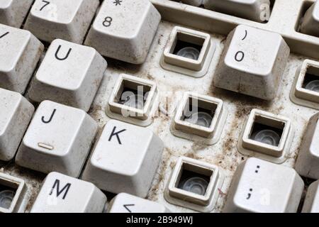 Old broken computer keyboard without keys closeup Stock Photo