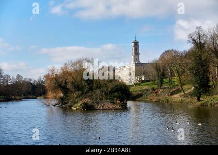 The Trent building at Nottingham University Park Campus seen over the boating lake on a sunny spring morning Stock Photo