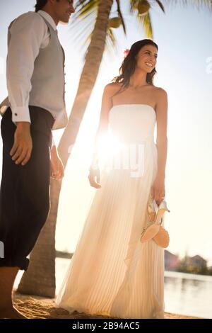 Portrait of a newlywed couple on a tropical beach. Stock Photo