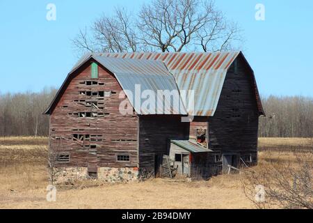A Barn Relic Remains Standing In A Pasture Stock Photo