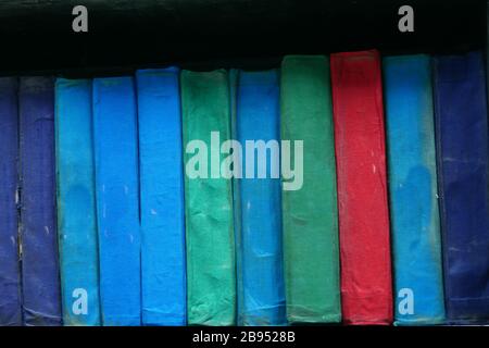 Old books on a wooden shelf.close up. Stock Photo