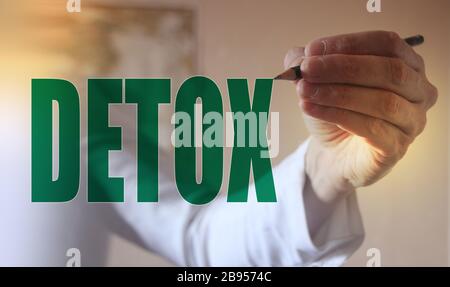 Doctor pointing word Detox with marker, Medical concept Stock Photo