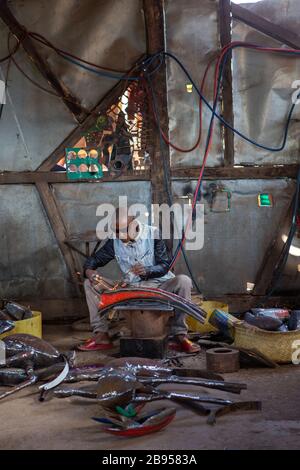 Welder in the social and solidarity enterprise of metalworking with recycled material created by Violette and Dieudonne in Antananarivo Stock Photo