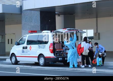 (200323) -- HANOI, March 23, 2020 (Xinhua) -- Passengers are transferred to a hospital for quarantine after returning from Japan by air at Cam Ranh International Airport in Vietnam's province of Khanh Hoa, on March 22, 2020. Vietnam's Ministry of Health on Monday night announced that two more people have tested positive for the COVID-19, bringing the total confirmed cases in the country to 123. (VNA via Xinhua) Stock Photo