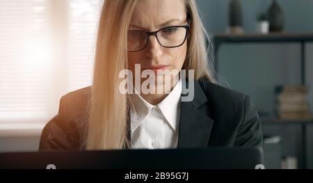 Businesswoman looking computer screen close-up Stock Photo