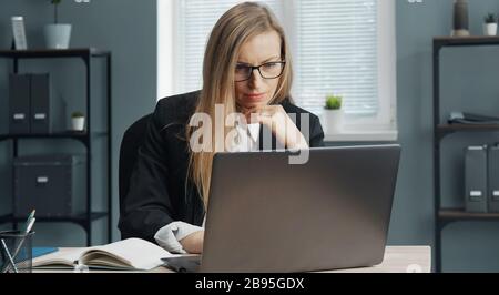 Businesslady working laptop in office Stock Photo