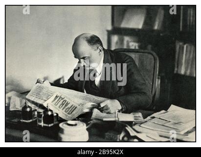 LENIN Archive c1918 Vladimir Lenin reading a copy of PRAVDA newspaper in his office Moscow USSR (1870-1924) Stock Photo