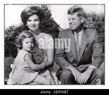 JFK Democratic Presidential nominee, Senator John F. Kennedy archive campaign photograph with his family in summer home garden July 21st. 1960 with his wife, Jacqueline Kennedy holding Caroline Kennedy Hyannis Port USA Stock Photo