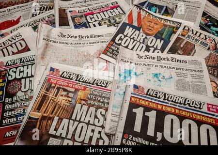 A collection of headlines of the New York newspapers on the national emergency declared in response to the COVID-19 outbreak, seen on Monday, March 23, 2020. (© Richard B. Levine) Stock Photo