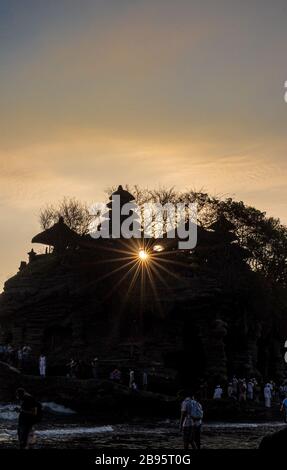 Pura Tanah Lot Temple, Bali at sunset. For the Balinese, Pura Tanah Lot is one of the most important and venerated sea temples. Stock Photo