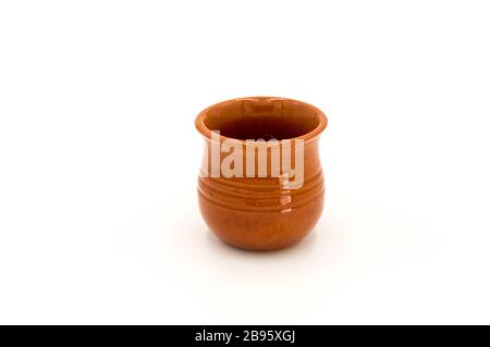 Porcelain puffed ramekin dish in brown color isolated on white background Stock Photo