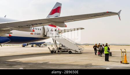 LONDON GATWICK AIRPORT, ENGLAND - APRIL 2019: Passengers disembarking a British Airways Airbus after arriving at London Gatwick Airport Stock Photo
