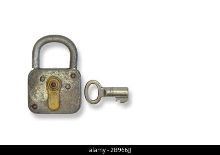 rusty old padlock with key, close up, isolated on white background Stock Photo