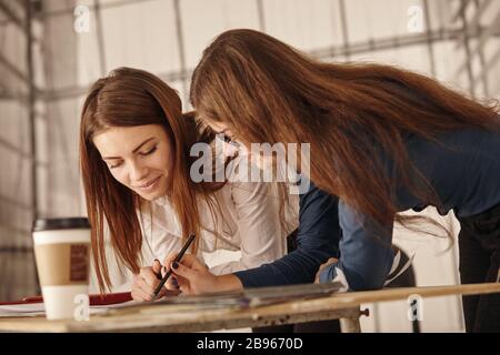 Two young architects working on a project Stock Photo