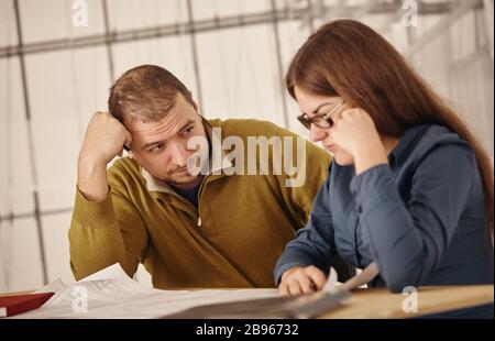 Two young architects working on a project Stock Photo