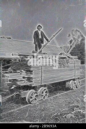 Negative - Colac, Victoria, circa 1925, A man with a load of milled timber loaded on a rail truck. There is a small building in the background., Reimagined by Gibon, design of warm cheerful glowing of brightness and light rays radiance. Classic art reinvented with a modern twist. Photography inspired by futurism, embracing dynamic energy of modern technology, movement, speed and revolutionize culture. Stock Photo