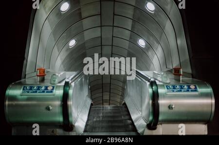 Empty subway escalator in London underground. Stock Photo