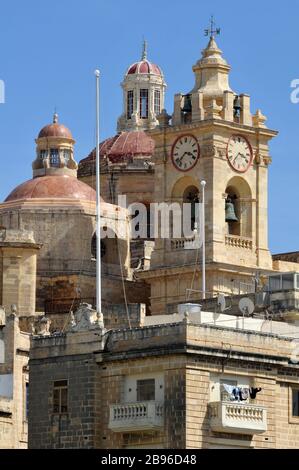 The towers of the Collegiate Church of the Immaculate Conception are a landmark in Cospicua, Malta, one of the Three Cities near Valletta. Stock Photo