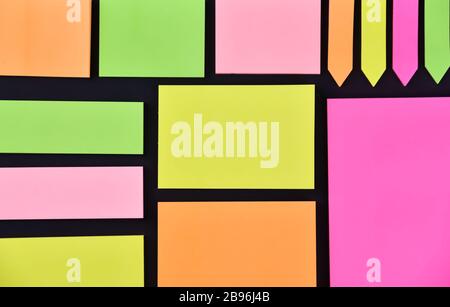 Bright multicolored different clear paper stickers on the black background Stock Photo