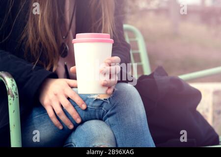 Female hands hold reusable coffee mug.Sustainable lifestyle concept. Stock Photo