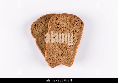 Two slices of brown bread on white background Stock Photo