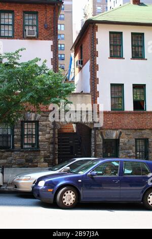 Pomander Walk is a cooperative apartment complex located on the Upper West Side, Manhattan on JULY 25th, 2019 in New York, USA. (Photo by Wojciech Mig Stock Photo