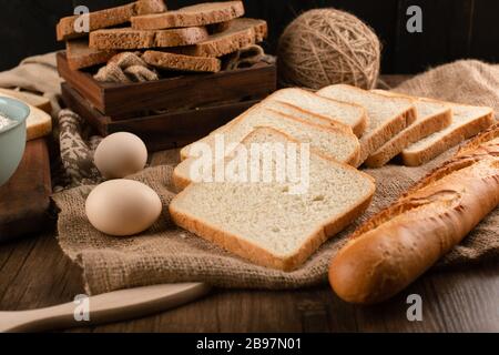 Eggs with slices of bread and french baguette Stock Photo