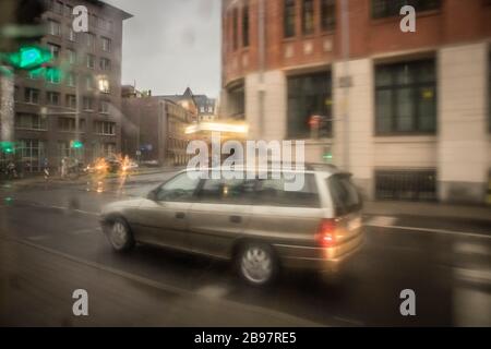 Leipzig, Germany, 05-30-2017 Viewing the street scenes on a rainy day through the window of the tram with blurs Stock Photo